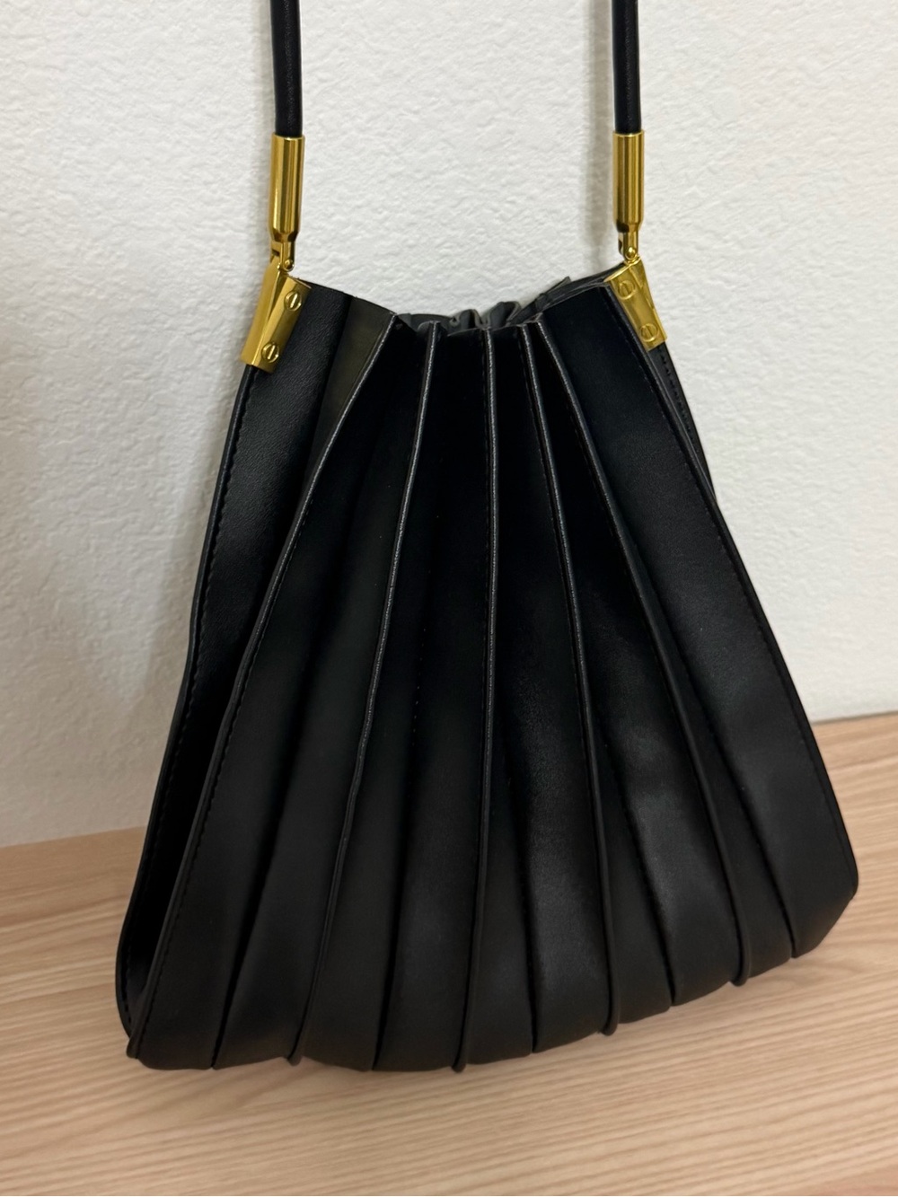 Melie Bianca Black Pleated Shoulder Bag with Gold Accents